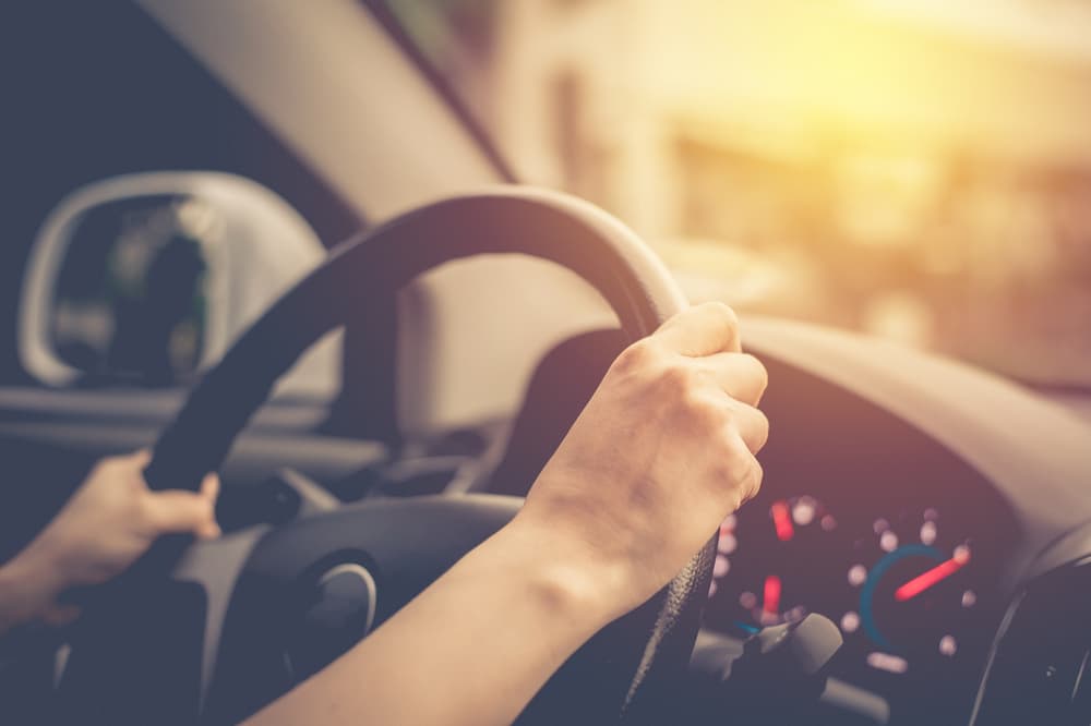 Female driving car. Vintage filter